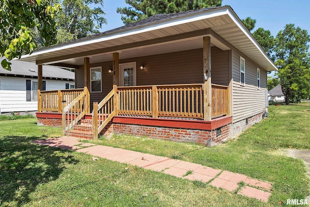 view of front of property featuring a porch, a front yard, and crawl space