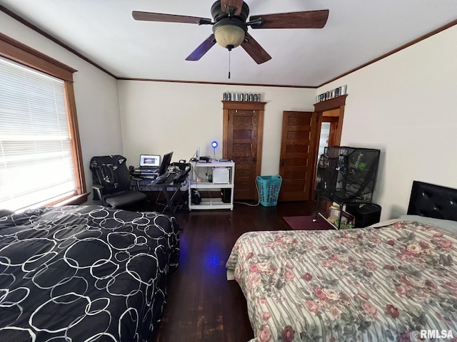 bedroom featuring ceiling fan, crown molding, and wood-type flooring