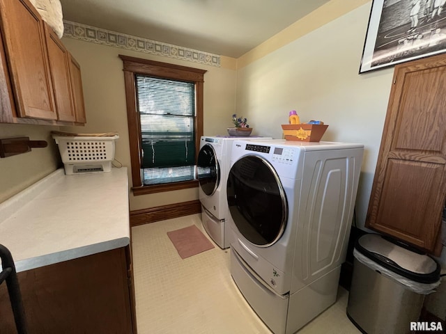 laundry area with cabinets and washing machine and dryer