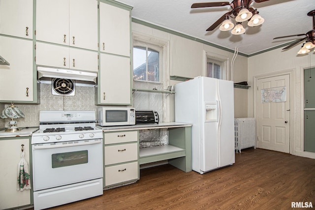 kitchen with white appliances, dark wood-style flooring, light countertops, backsplash, and radiator