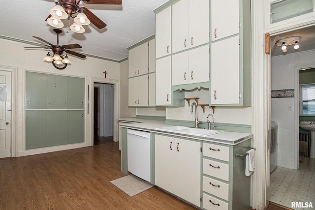 kitchen featuring light wood-style flooring, white dishwasher, light countertops, a textured ceiling, and a sink