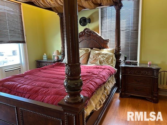 bedroom featuring wood finished floors