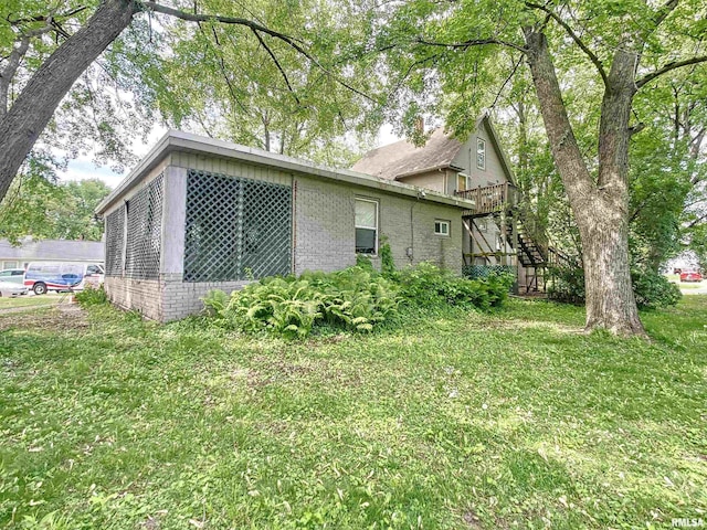 view of home's exterior featuring a lawn