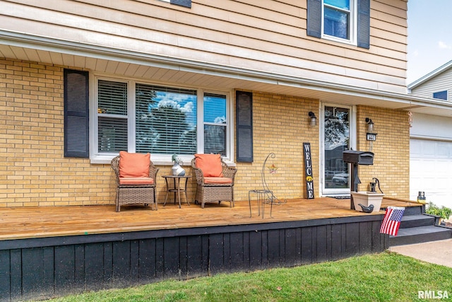 view of exterior entry with brick siding