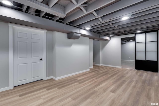 basement with light wood-type flooring