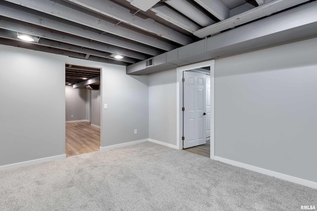 basement featuring carpet flooring