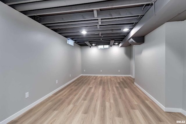 basement featuring light hardwood / wood-style flooring