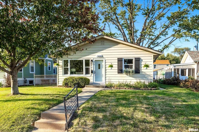 bungalow with a front lawn