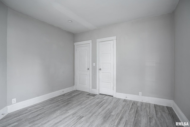 unfurnished bedroom with light hardwood / wood-style flooring