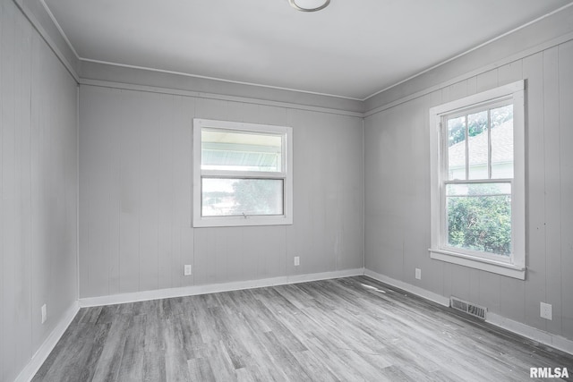 unfurnished room with light hardwood / wood-style floors