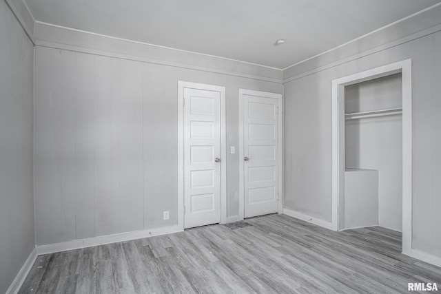 unfurnished bedroom with light wood-type flooring