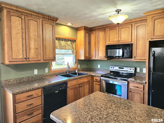 kitchen with black appliances and sink