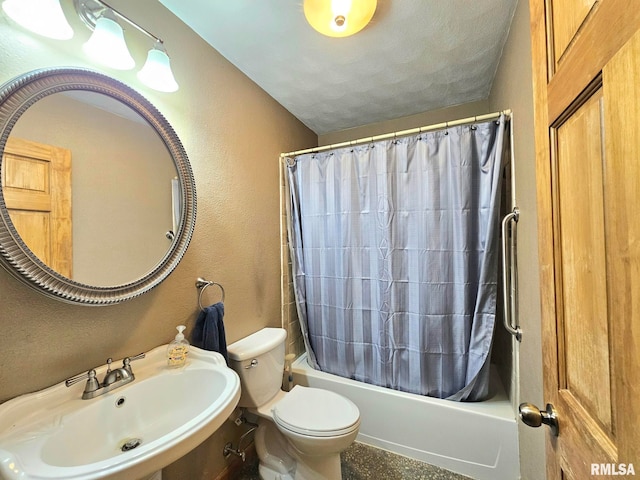 full bathroom featuring toilet, shower / tub combo with curtain, and sink