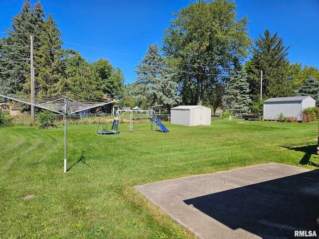 view of yard with a playground and a storage shed