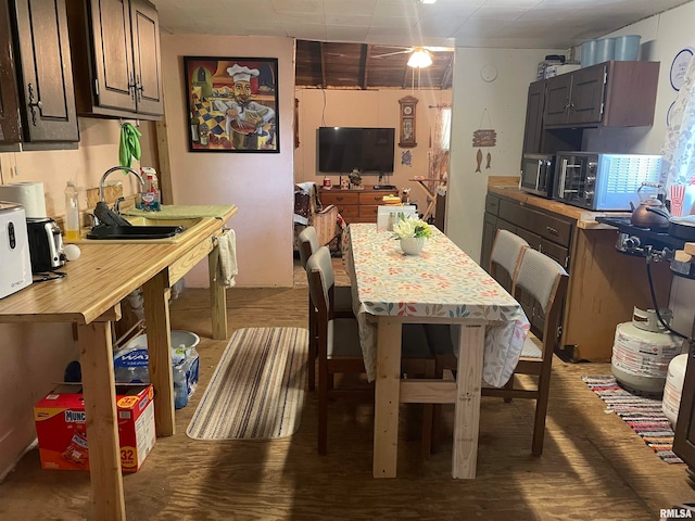 dining room featuring hardwood / wood-style floors and sink