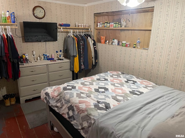 bedroom featuring dark wood-type flooring and ornamental molding