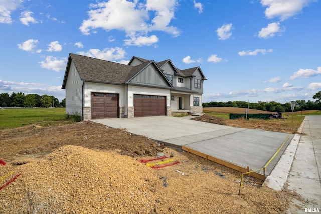 view of side of property featuring a lawn and a garage