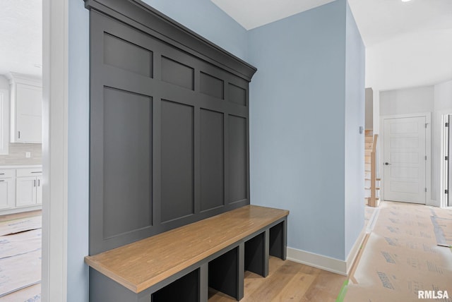 mudroom with light hardwood / wood-style flooring