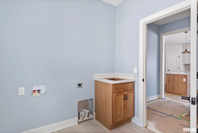 laundry area with hookup for a washing machine and hookup for an electric dryer