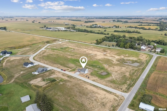 birds eye view of property with a rural view