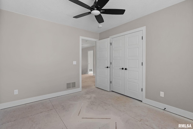 unfurnished bedroom with a textured ceiling, a closet, and ceiling fan