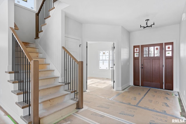 foyer entrance with hardwood / wood-style flooring