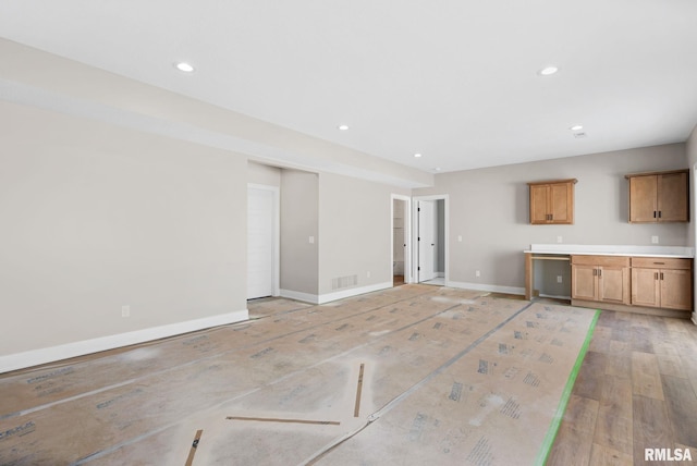 unfurnished living room with light wood-type flooring