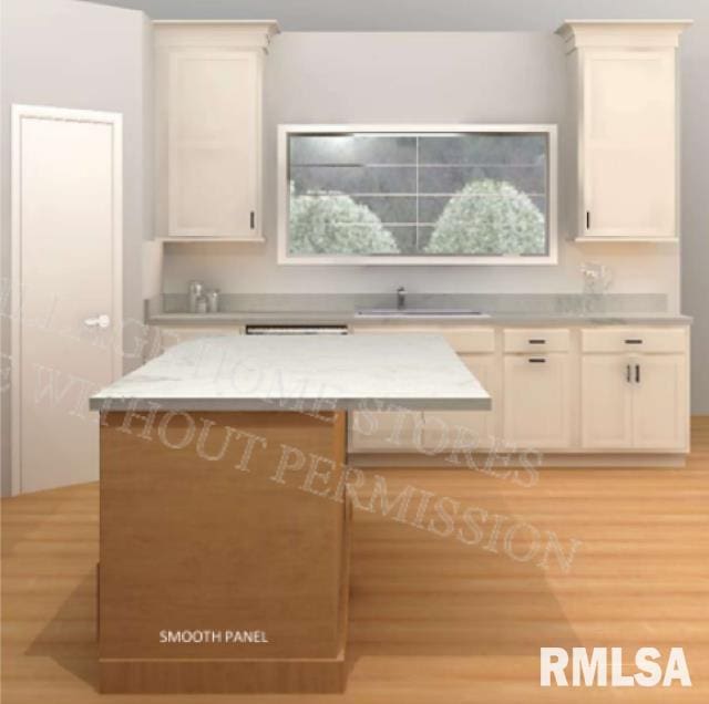 kitchen featuring light stone countertops, sink, and light hardwood / wood-style flooring