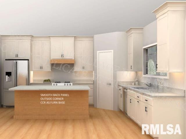 kitchen with appliances with stainless steel finishes, light wood-type flooring, sink, and a kitchen island