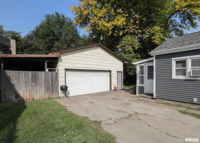 garage featuring a lawn