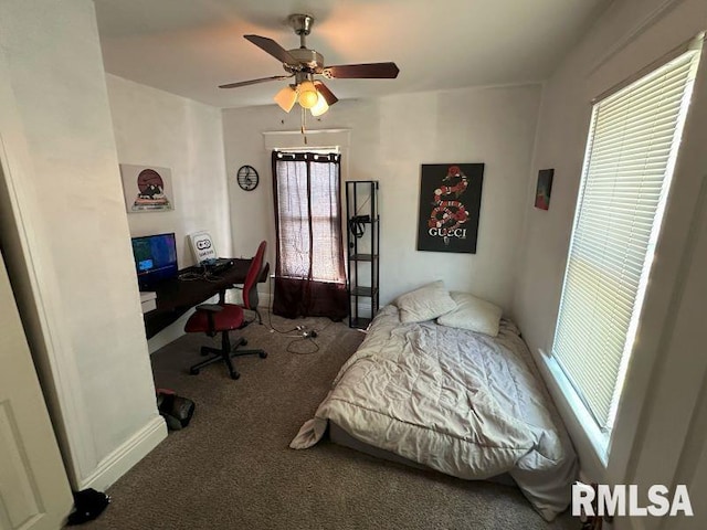 carpeted bedroom featuring a ceiling fan