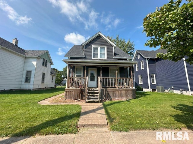 bungalow with a front lawn and covered porch