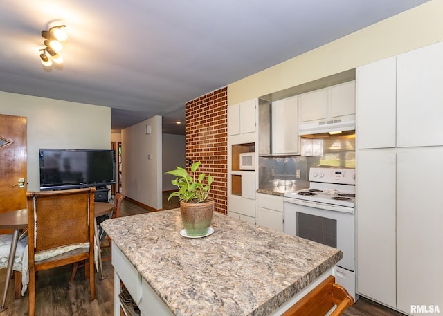 kitchen with dark wood-type flooring, white appliances, backsplash, and white cabinets