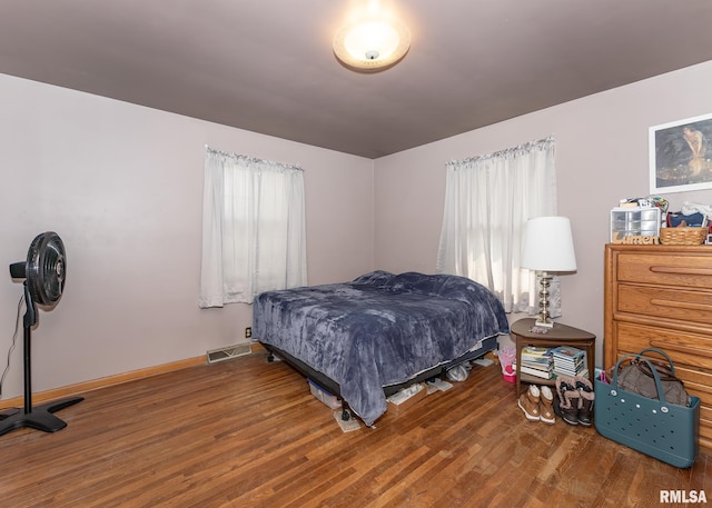 bedroom with hardwood / wood-style floors