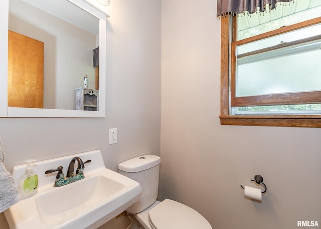 bathroom with toilet and sink