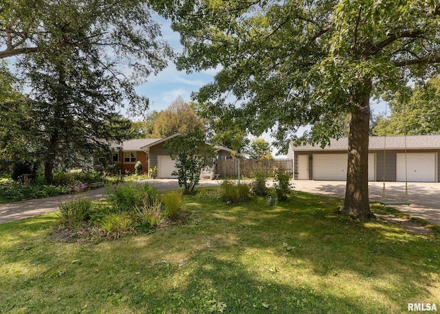 single story home with a garage and a front yard