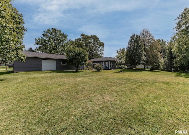 view of yard featuring a garage