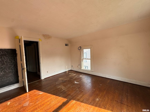 unfurnished room with hardwood / wood-style flooring