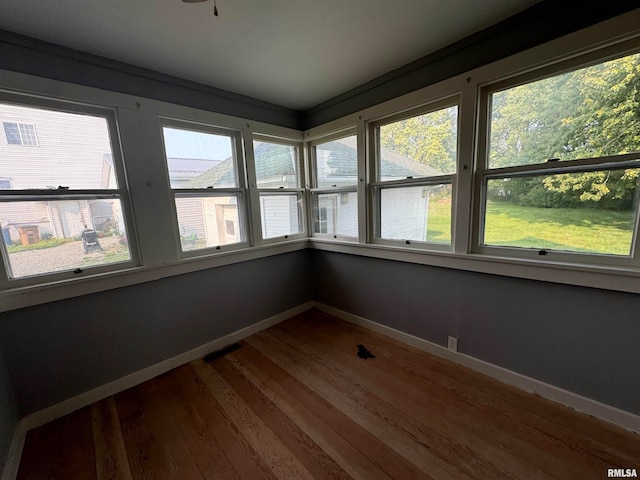 unfurnished sunroom with a healthy amount of sunlight