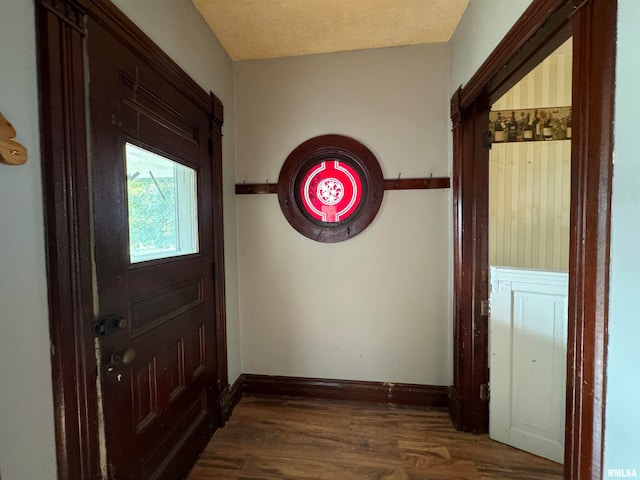 foyer entrance with dark hardwood / wood-style flooring