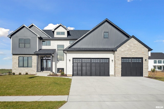 view of front of house featuring french doors, a front yard, and a garage