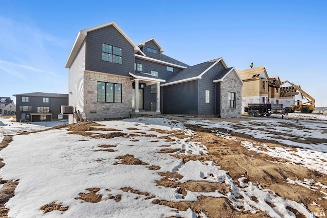 view of front of home featuring a residential view and stone siding