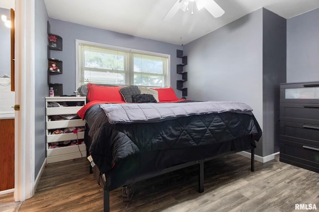 bedroom with ceiling fan and wood-type flooring