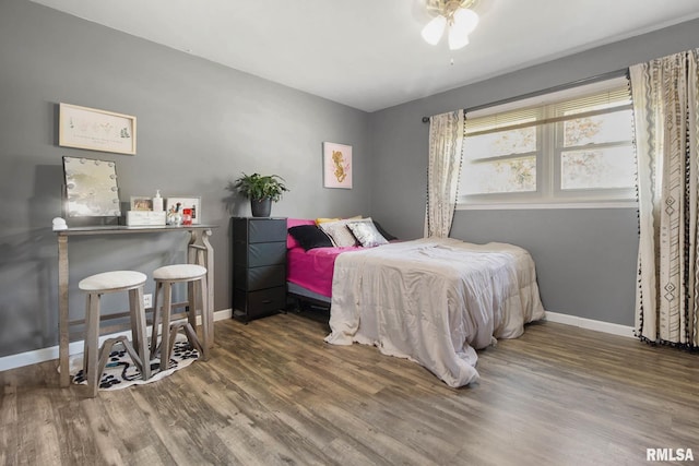 bedroom featuring dark wood-type flooring