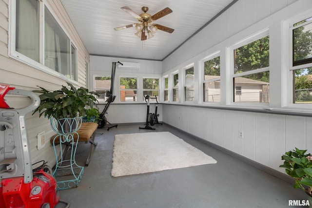 sunroom / solarium featuring ceiling fan and plenty of natural light