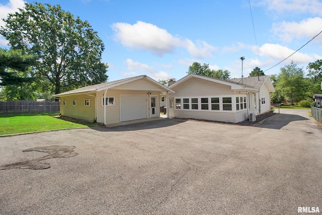 exterior space with a garage and a front yard