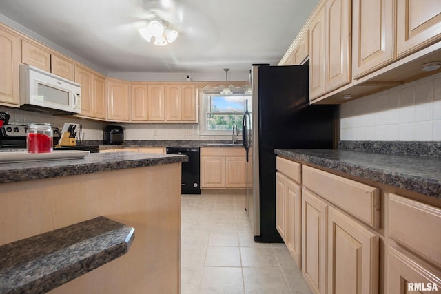 kitchen with dishwasher, stove, tasteful backsplash, and hanging light fixtures