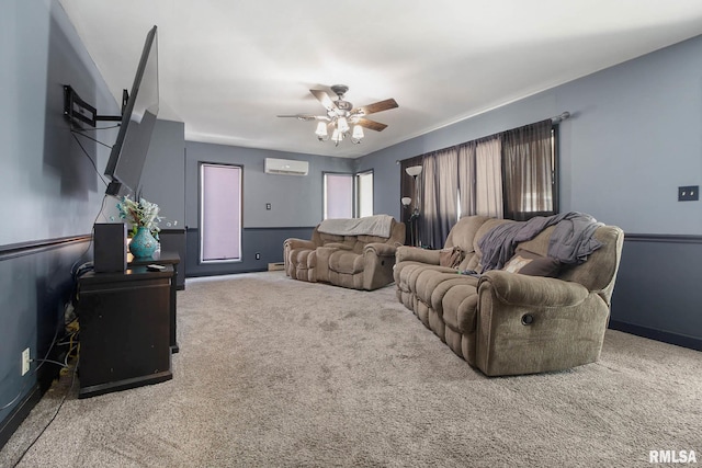 living room with a wall mounted AC, ceiling fan, and carpet floors