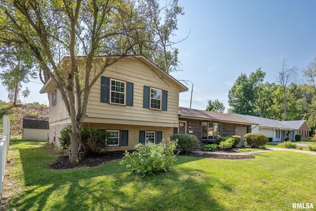 tri-level home featuring a front yard