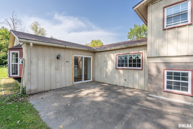 entrance to property with a patio